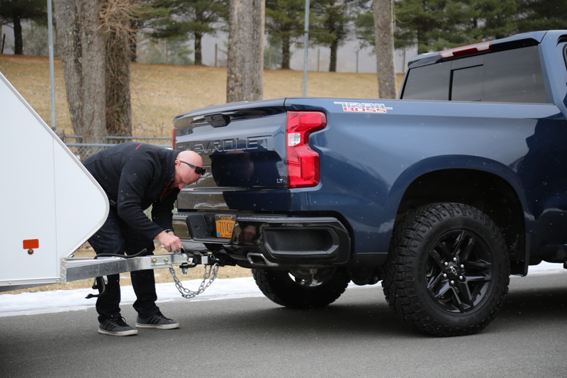 Chevy Performance Engineer Aaron Pfau hooking a trailer up to the Silverado.